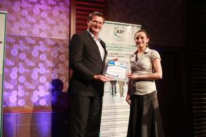 Betta Foods Australia technical officer Anna Roland receives the 2012 APPMA Scholarship from APPMA  chairman, Mark Dingley (left) at this year's AIP National Conference in Queensland.